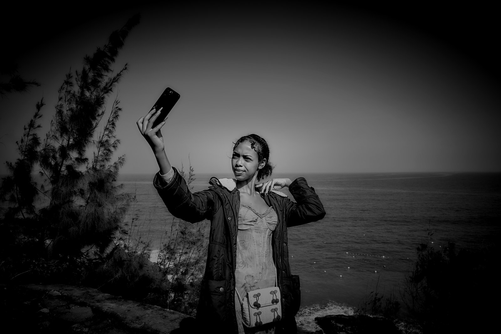 Amen, the Afrofeast brand ambassador, taking a selfie on a headland above the sea at Lang Co beach, Vietnam