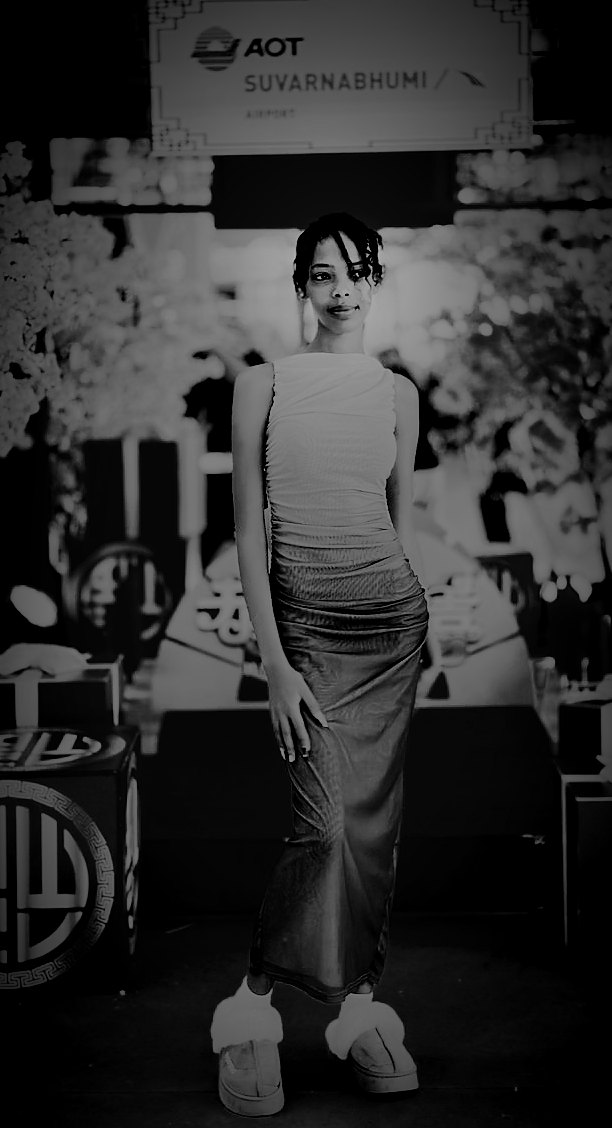 Amen, the Afrofeast brand ambassador, in a long skirt in front of festive decorations at Suvarnabhumi Airport (BKK), Bangkok, Thailand